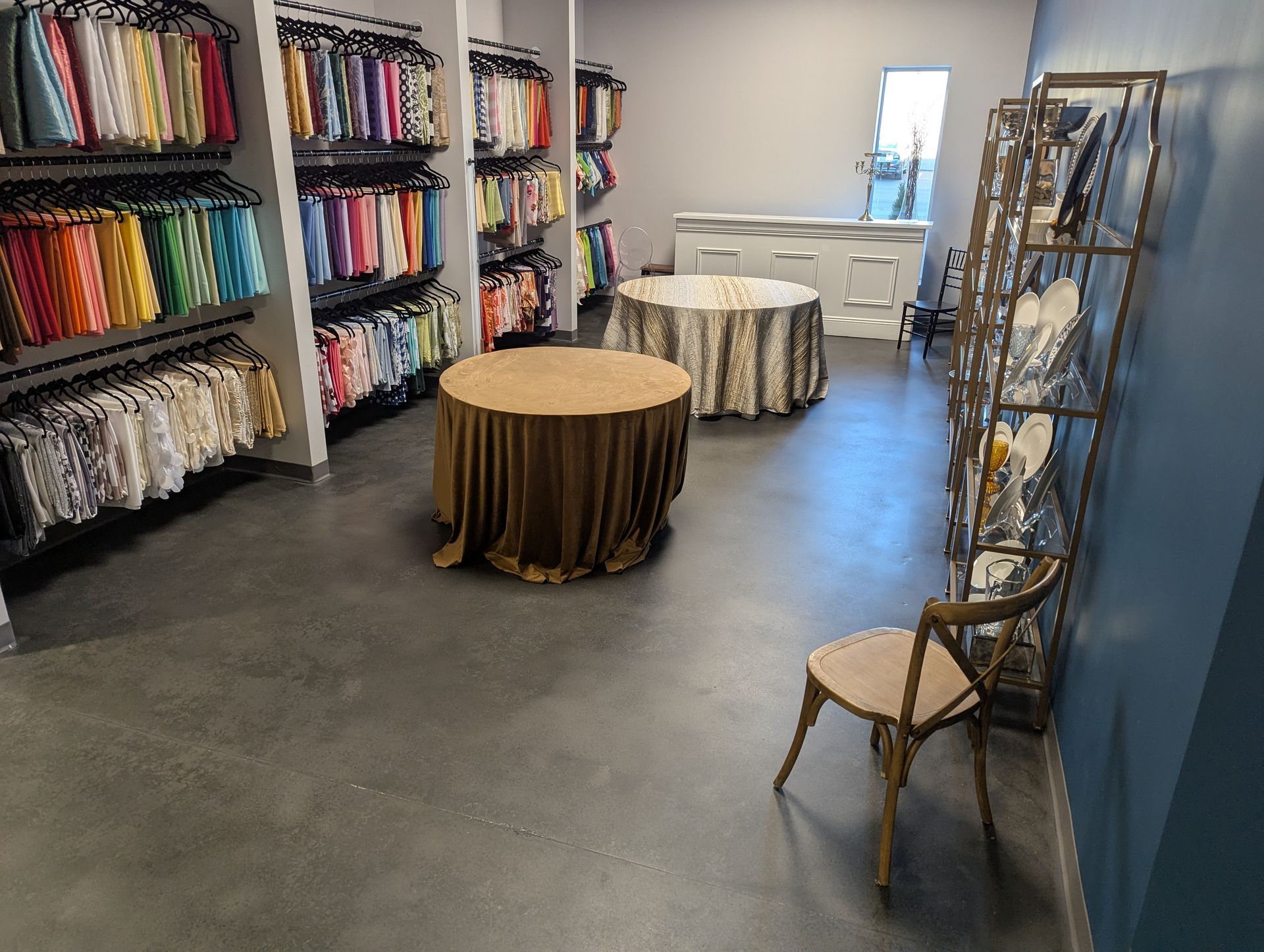 A room with tables and a chair in it