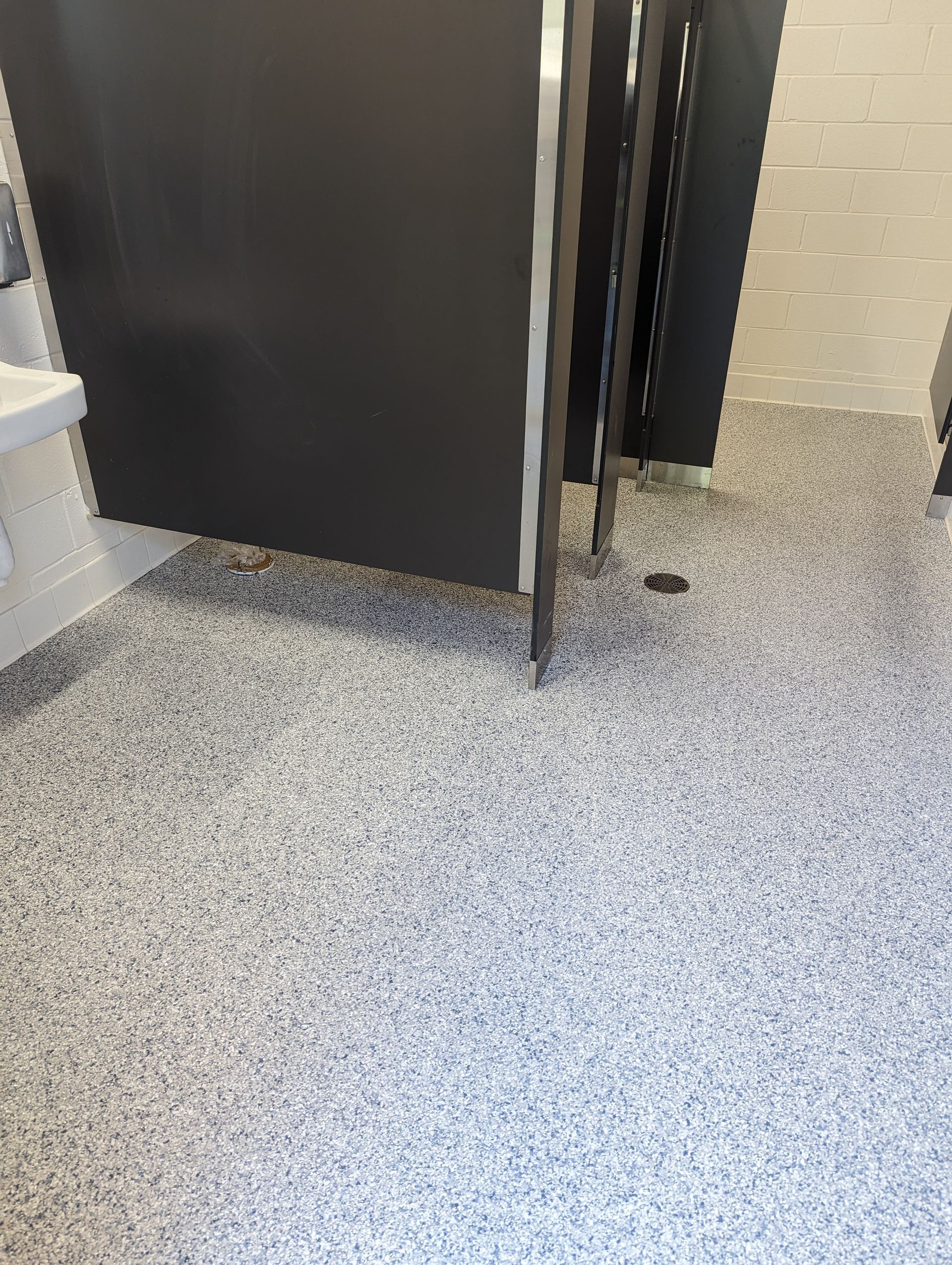 A close up of a shiny concrete floor in a room.