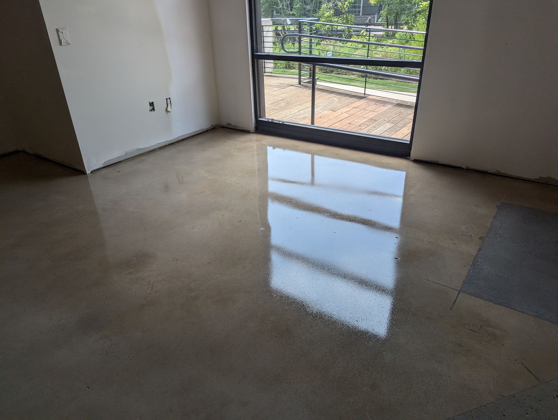 A close up of a black line on a gray and white floor.
