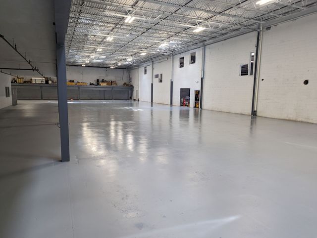 Repaired and tinted-sealed 40,000 square foot warehouse floor in Spartanburg, SC