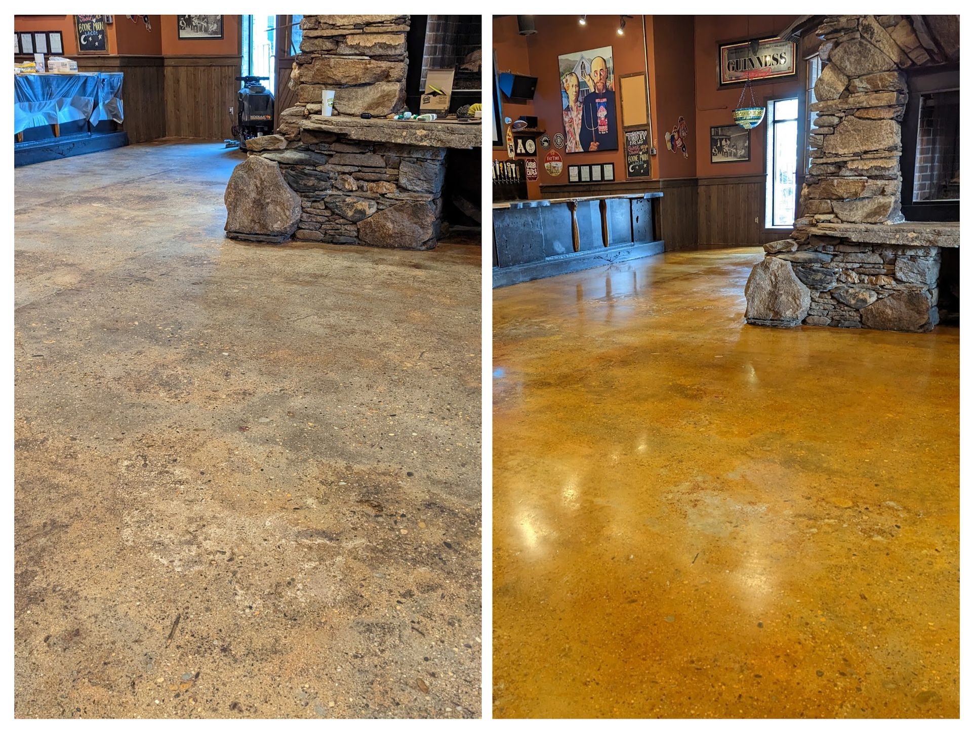 A large room with a concrete floor and a stone fireplace.