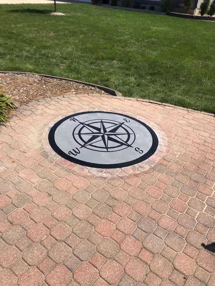 engraved concrete compass