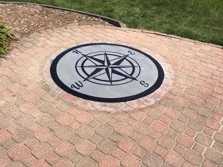 Stamped concrete compass design on a brick patio walkway installed by Blastek Concrete Designs in Boiling Springs, SC.