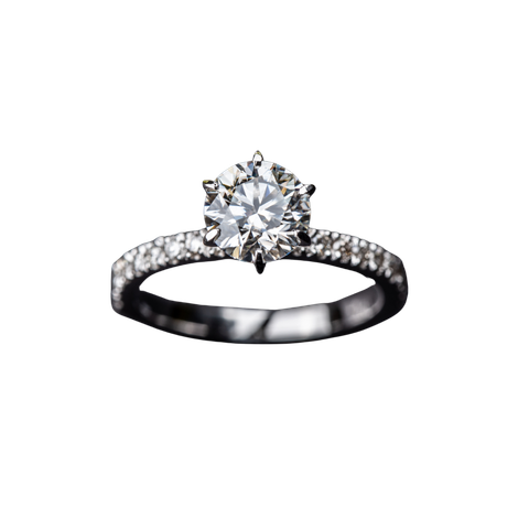 Diamond solitaire ring with a round stone and pavé band on a white background