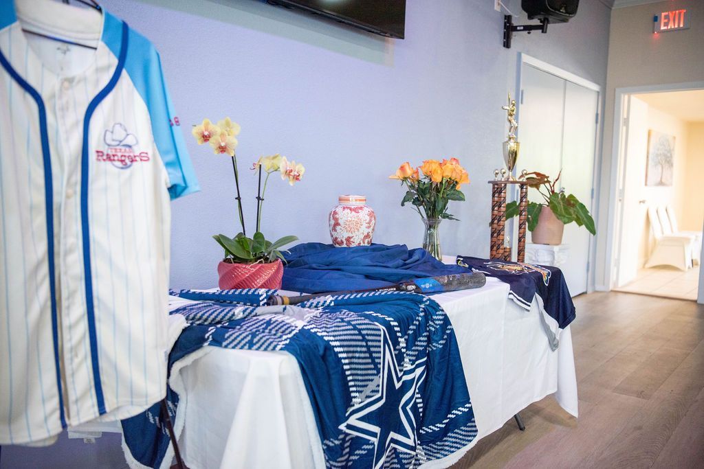Personalized memorial display featuring an urn and meaningful tribute items.