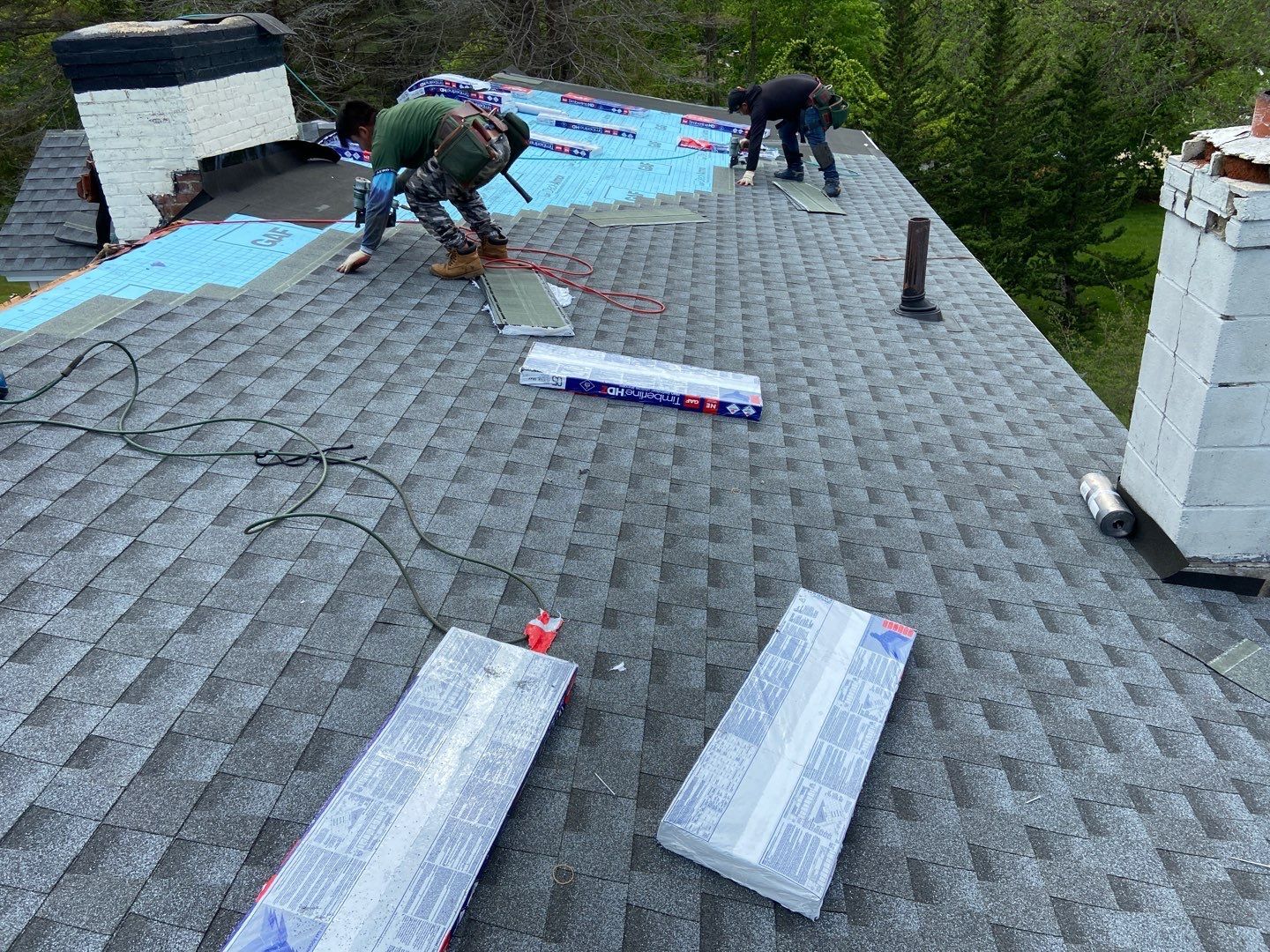 asphalt shingle being installed