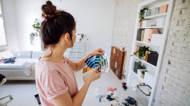 Woman Selecting Paint Color — Jacksonville, NC — C & S Paint Center