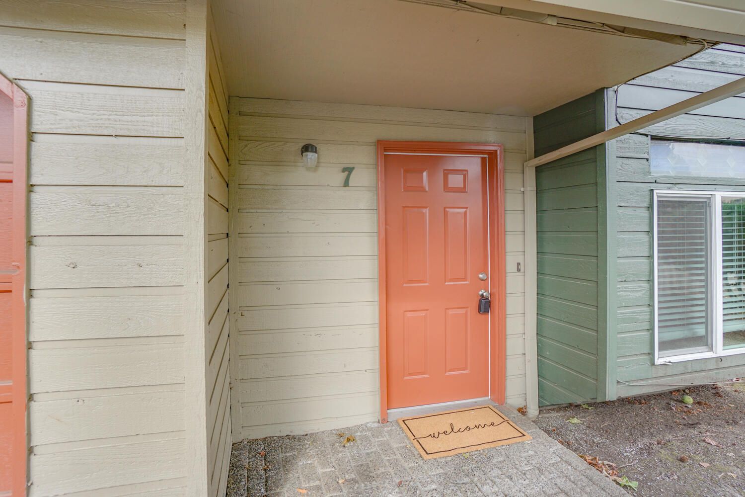 The front door of a house with the number 7 on it