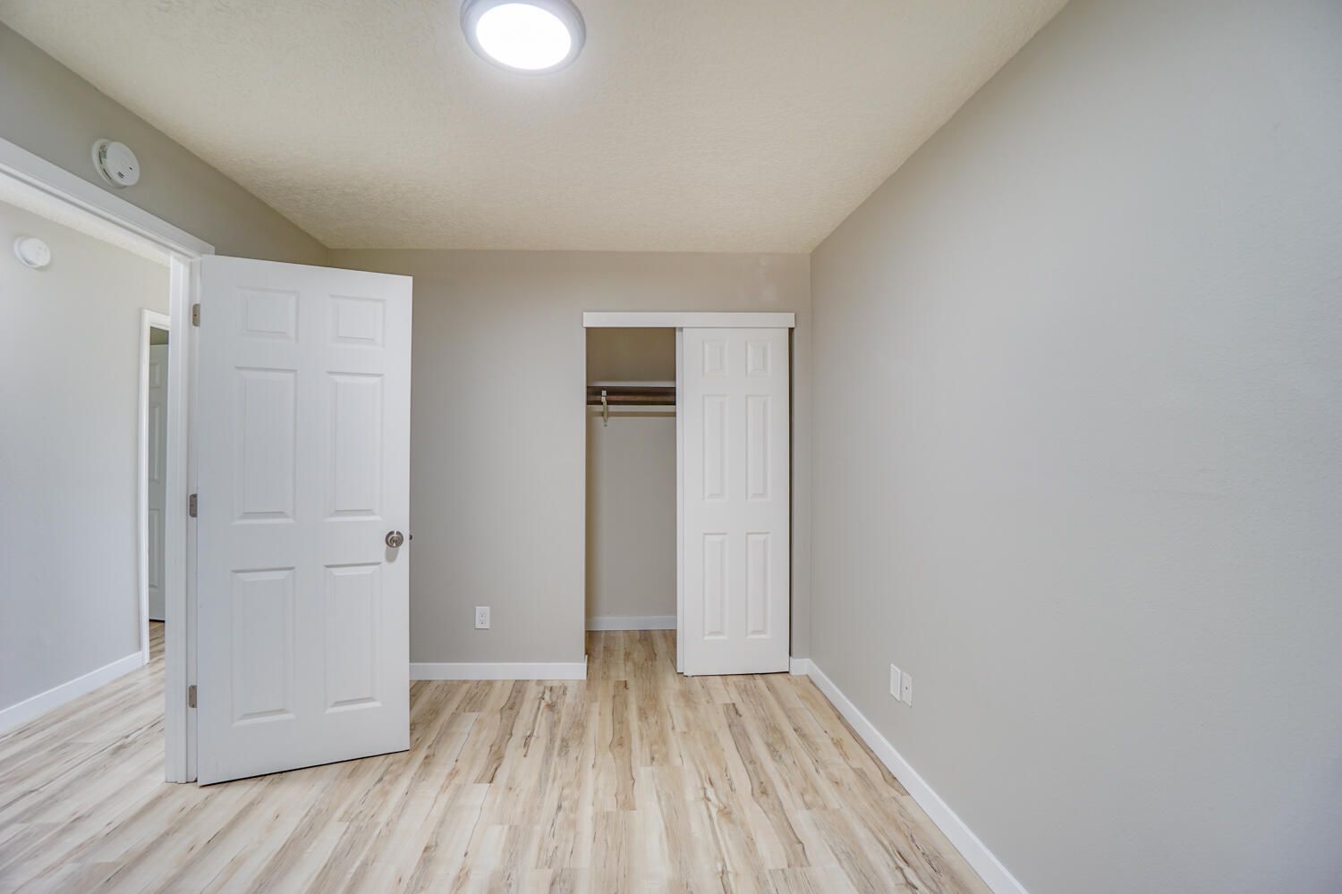 There is a closet in the corner of the room.