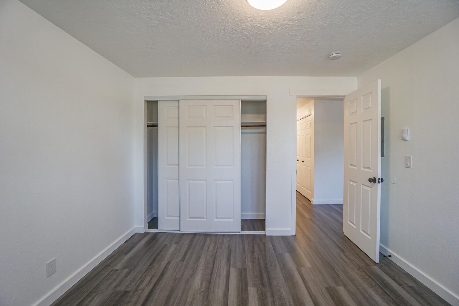 There is a closet in the middle of the room.