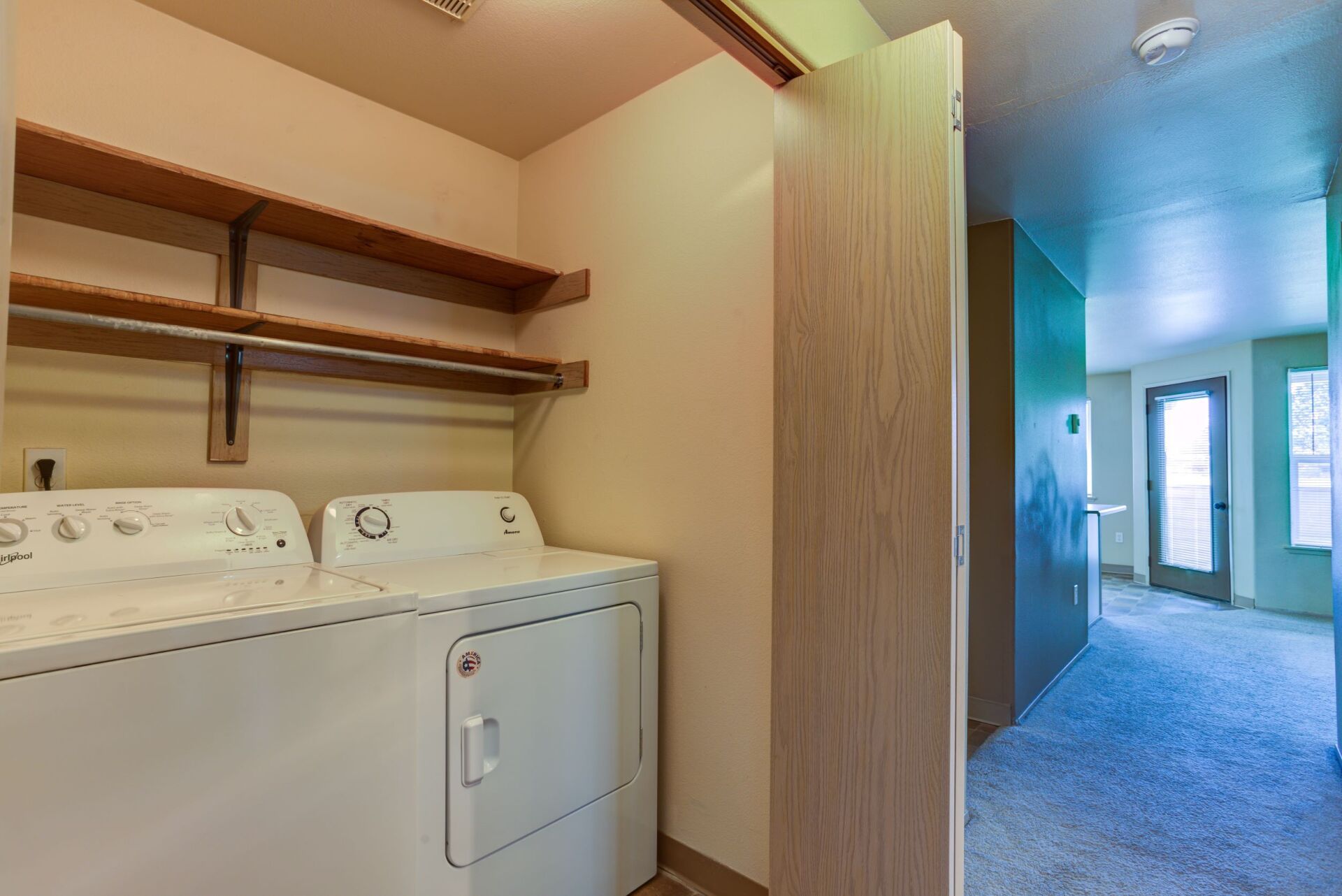 There is a washer and dryer in the laundry room.