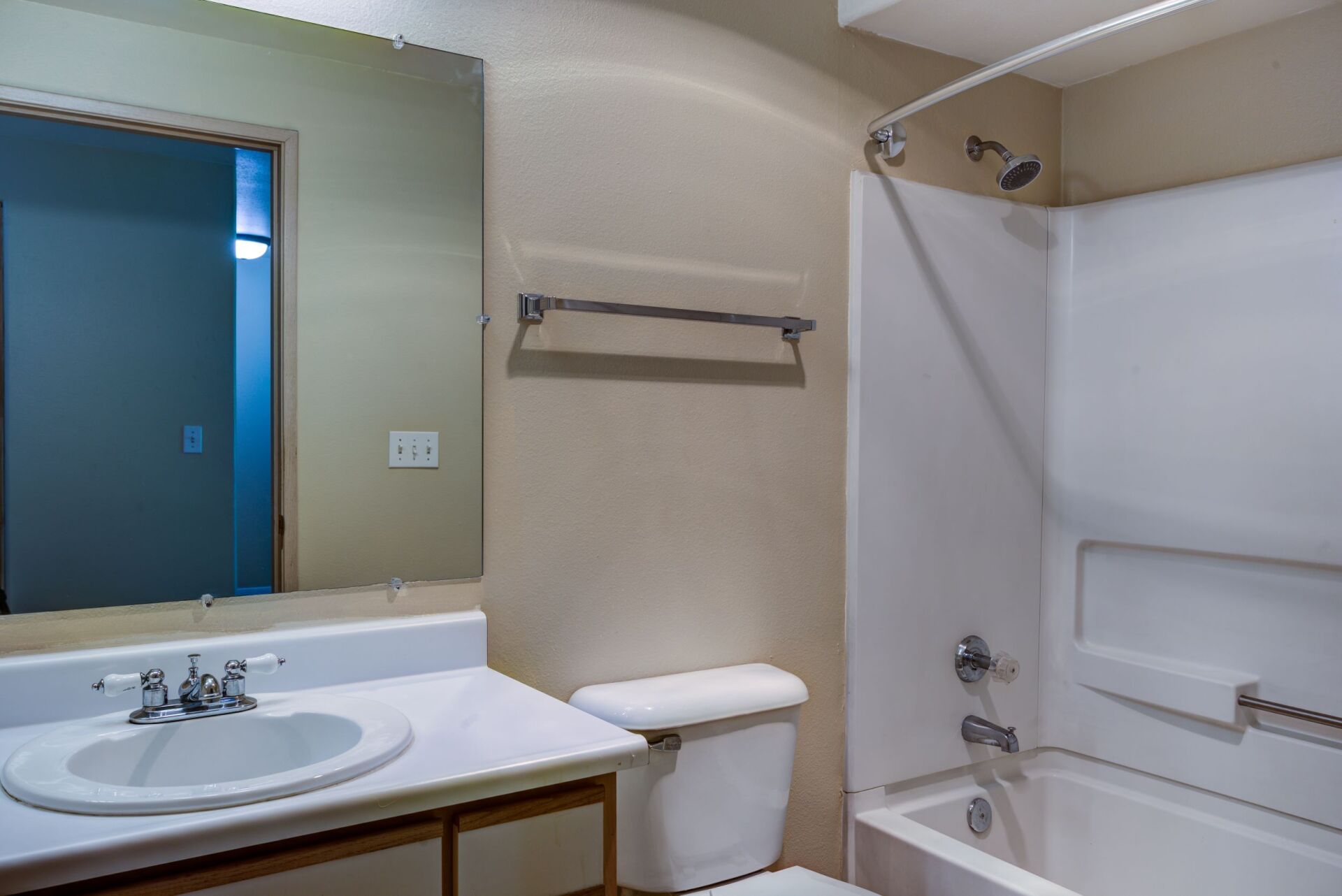 A bathroom with a sink , toilet , and bathtub.