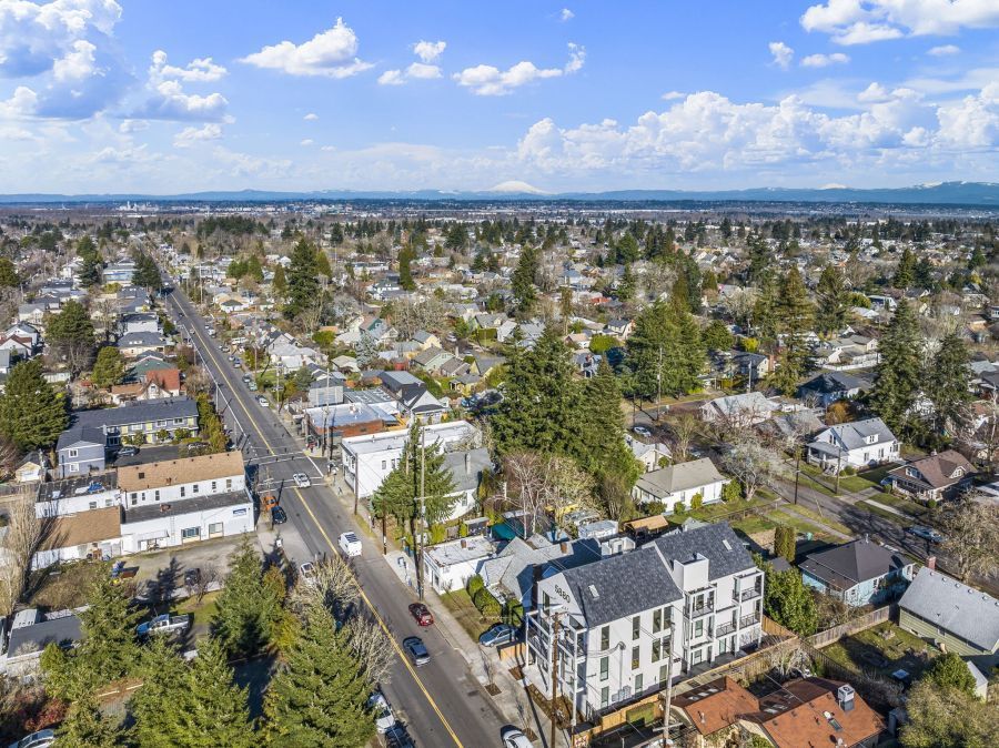 An aerial view of a residential area with lots of houses and trees.