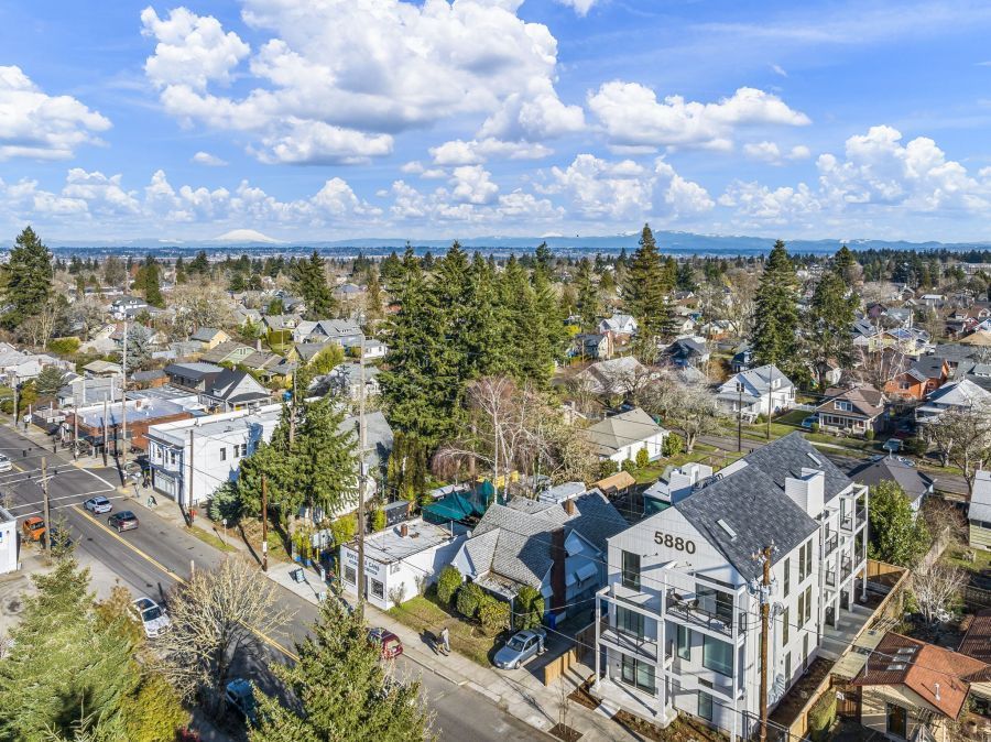 An aerial view of a residential area with a building in the middle of it.