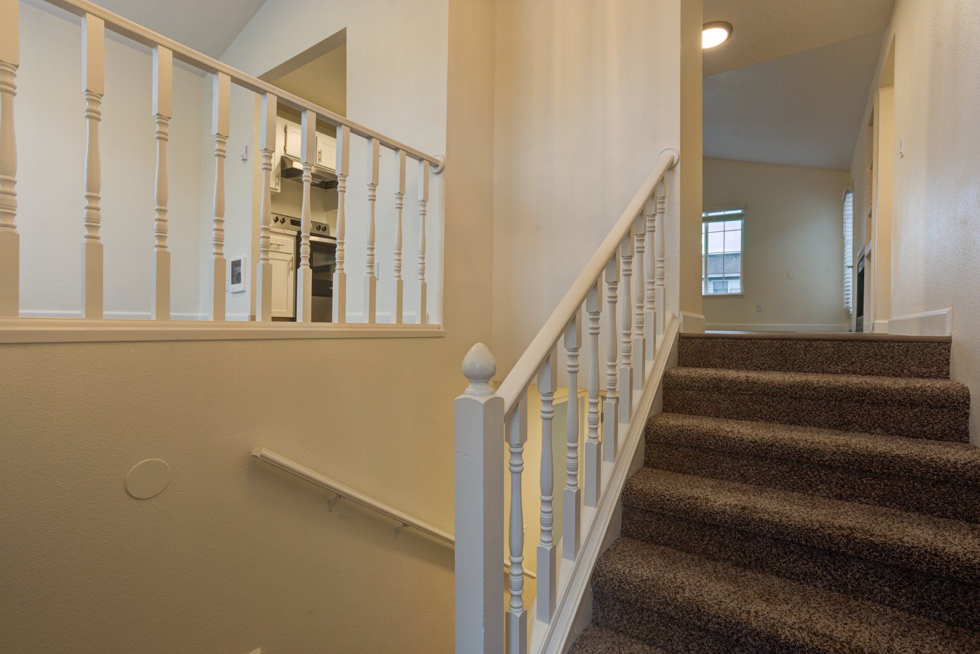 A set of stairs leading up to the second floor of a house.