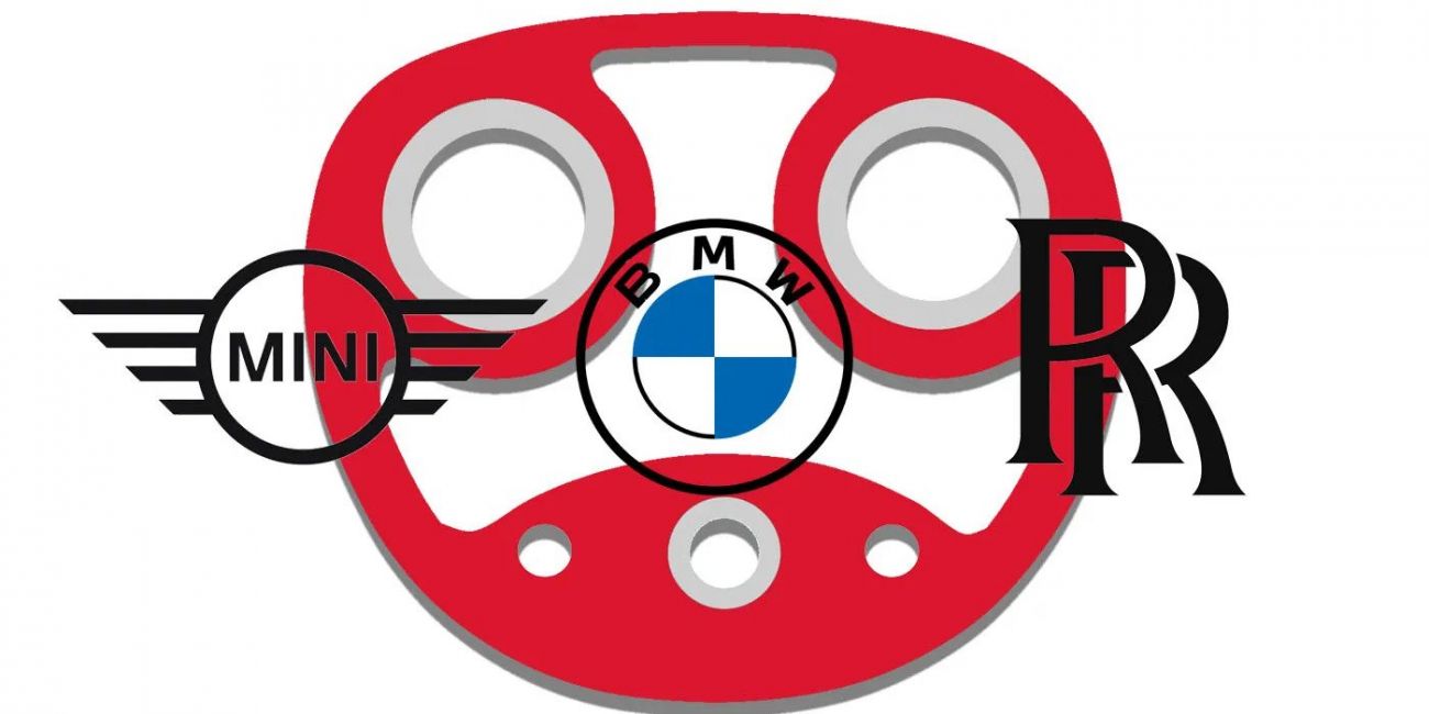 Red BMW steering wheel logo with MINI wings on the left and Rolls-Royce emblem on the right.