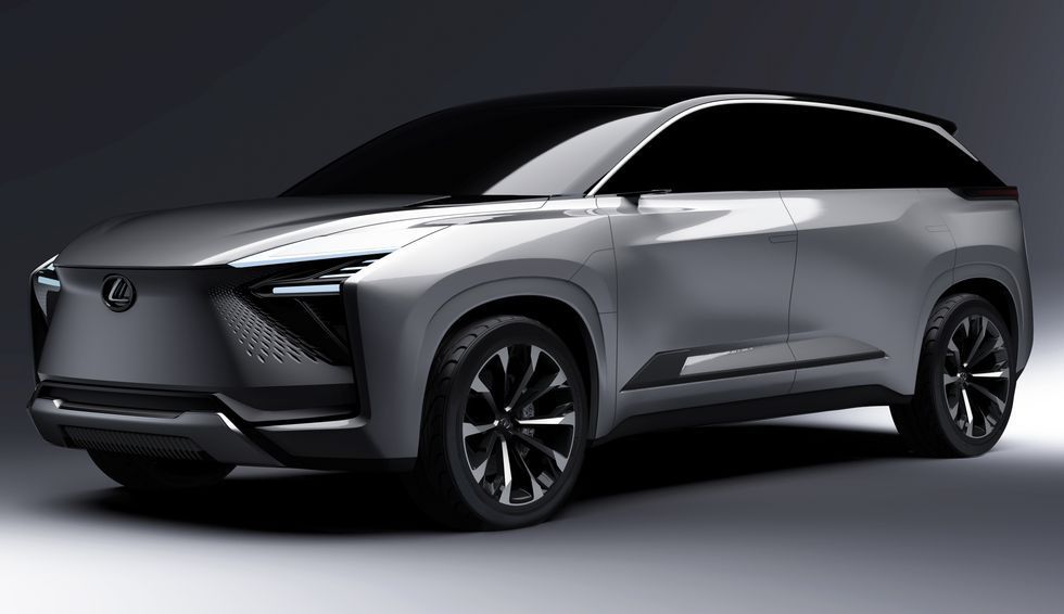 Silver Lexus SUV concept on a dark studio background, shown in three-quarter front view