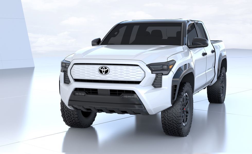 White Toyota pickup truck on a studio backdrop, shown from the front-left angle.