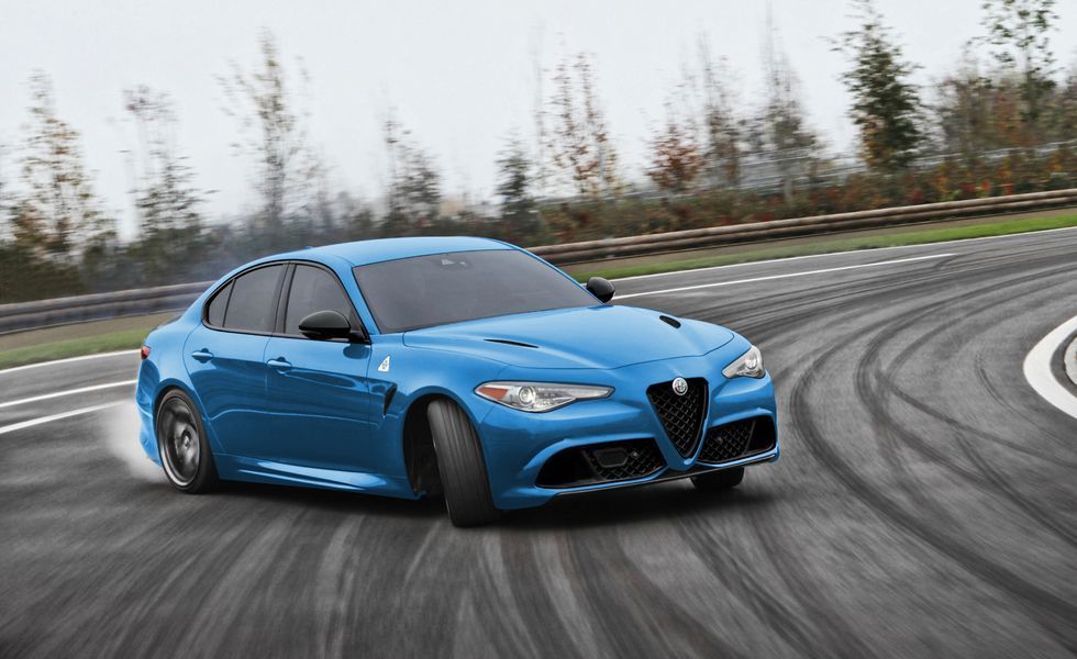 Blue Alfa Romeo sedan drifting on a wet track with tire marks