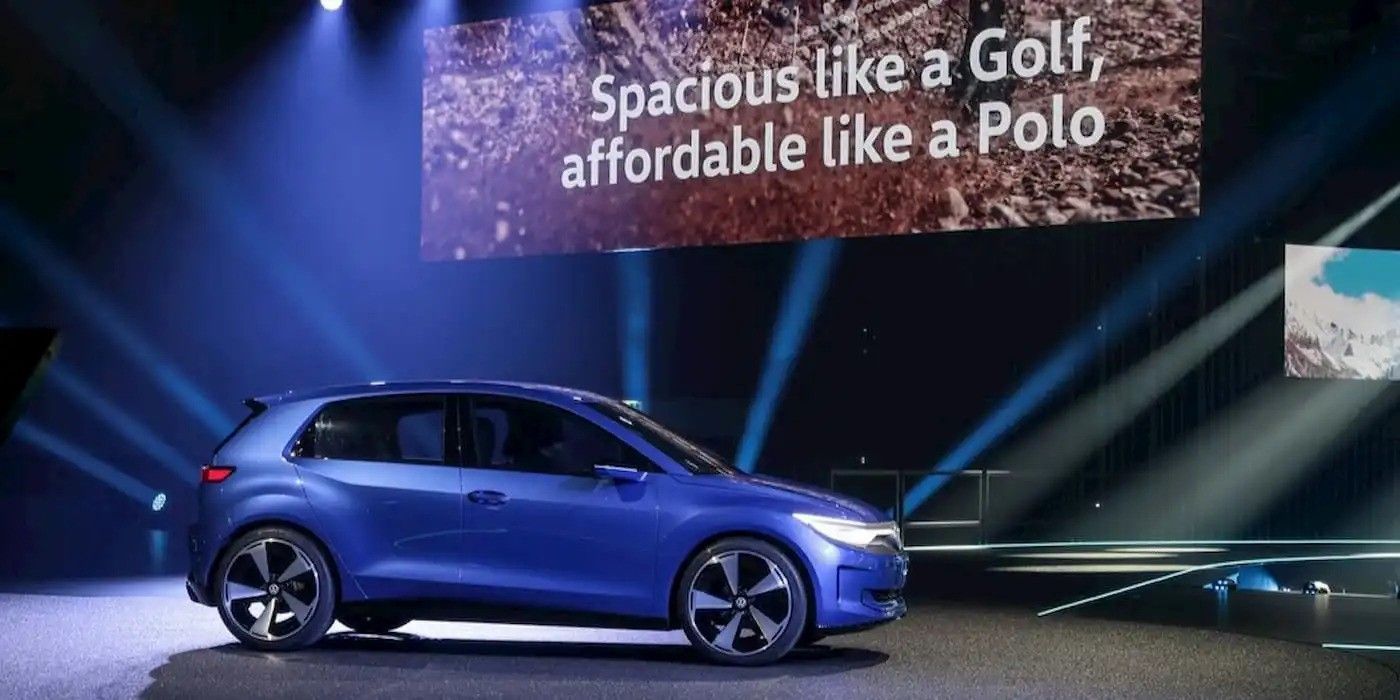 Blue Volkswagen hatchback on stage with slogan “Spacious like a Golf, affordable like a Polo”