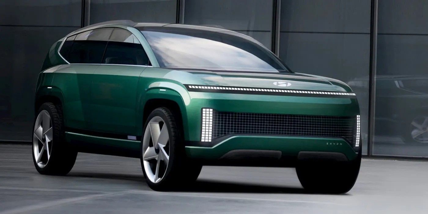 Dark green futuristic SUV concept car parked in a studio setting