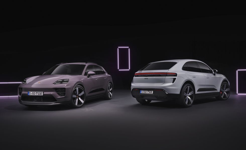 Two futuristic SUVs on a dark stage, one gray front view and one silver rear view with neon purple lights