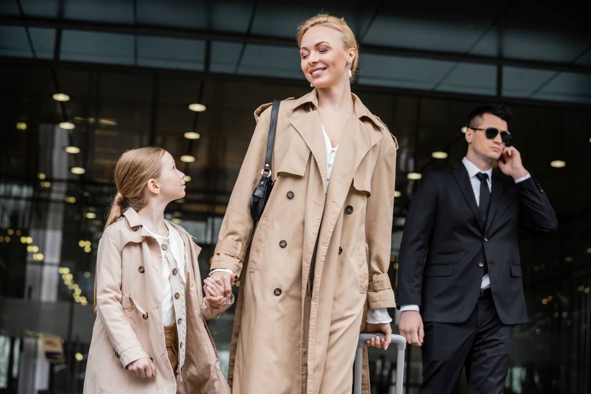Security professional providing private security to a mother and daughter.