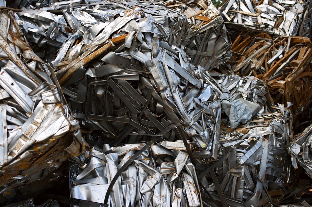 Scrap Metal Pile, Pressed Into Rectangular Bales, Mostly Silver and Brown Tones  — B & B Scrap Metal in Caloundra, QLD