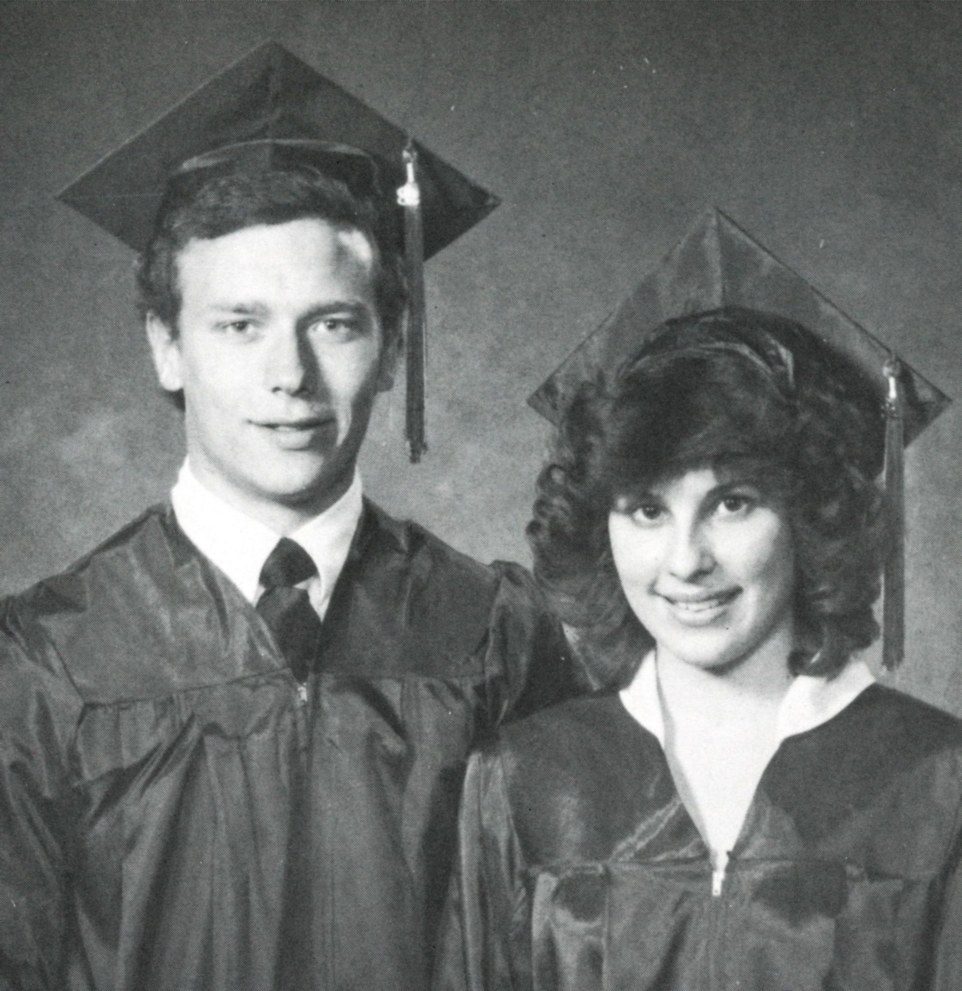 Male and female students in cap and gown - speakers at the 1982 graduation service