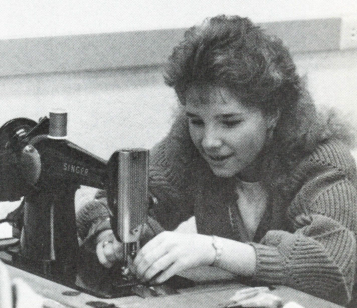 Female student using a sewing machine