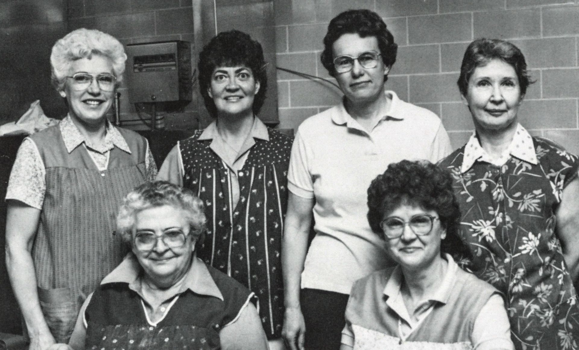 6 kitchen ladies, smiling at the camera