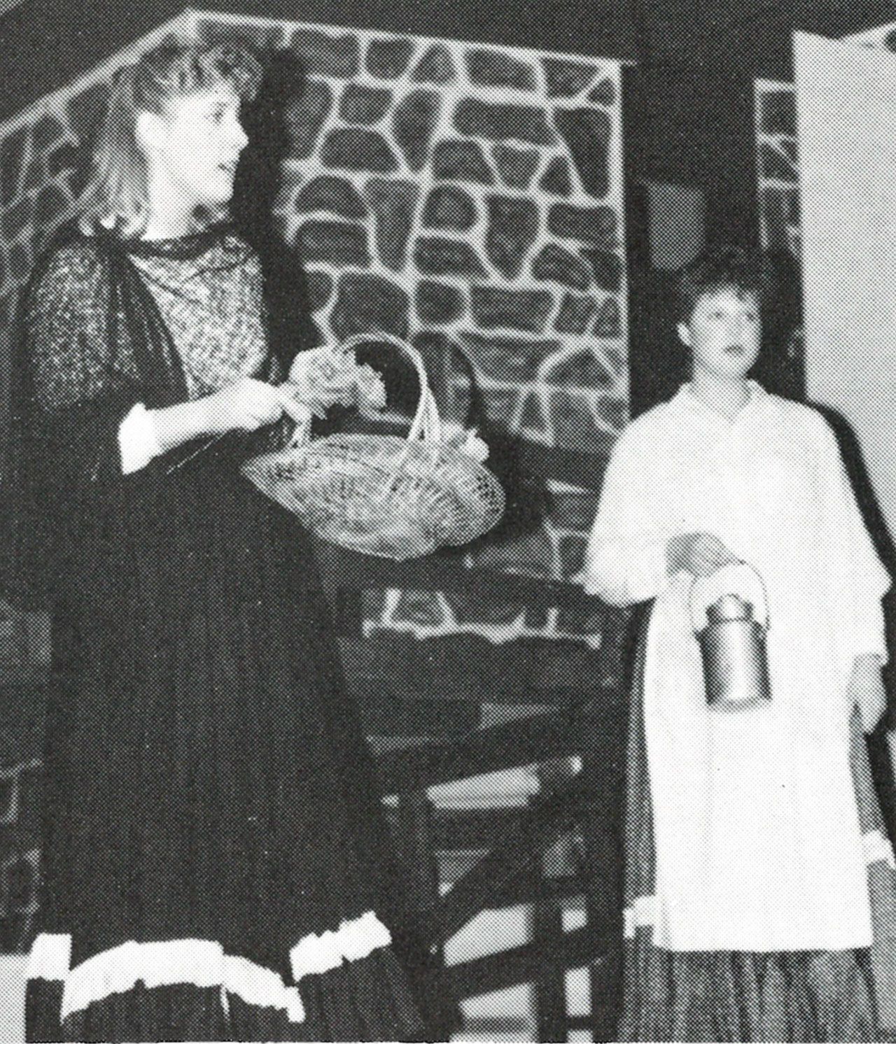 2 cast-member-students on stage performing