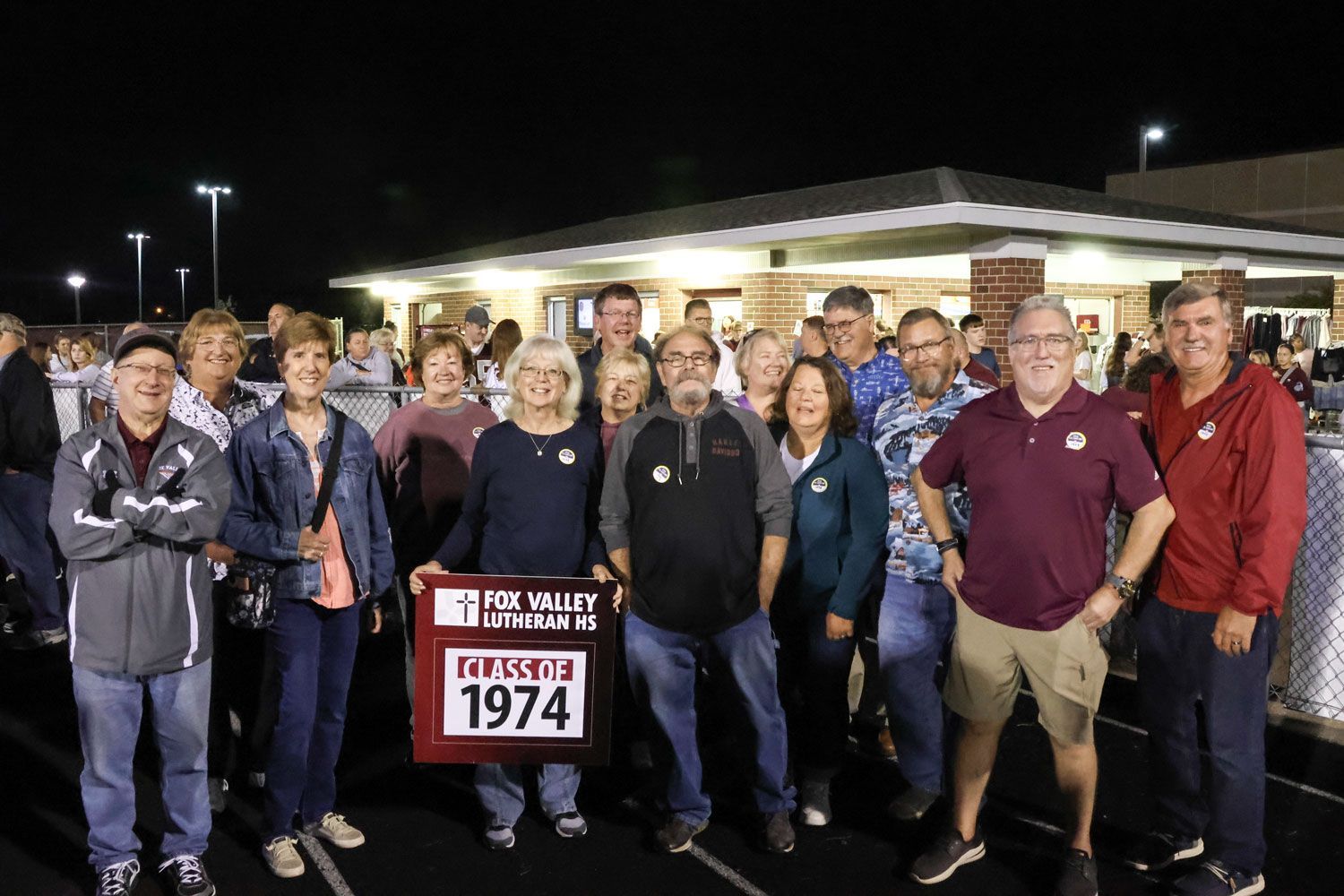 Class of 1974 outside at the Homecoming game