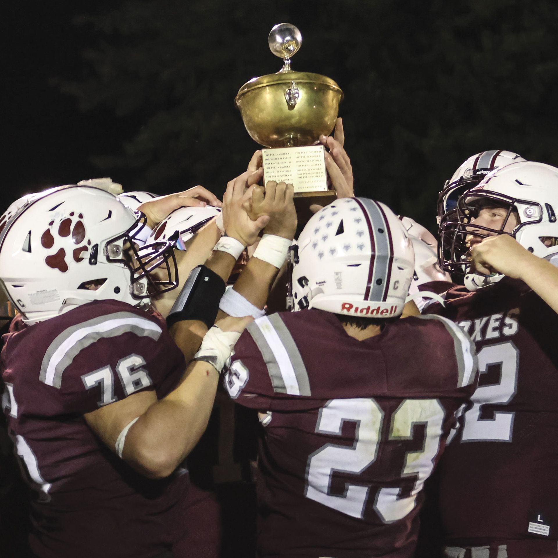 Victorious team holding the Apple Bowl trophy high