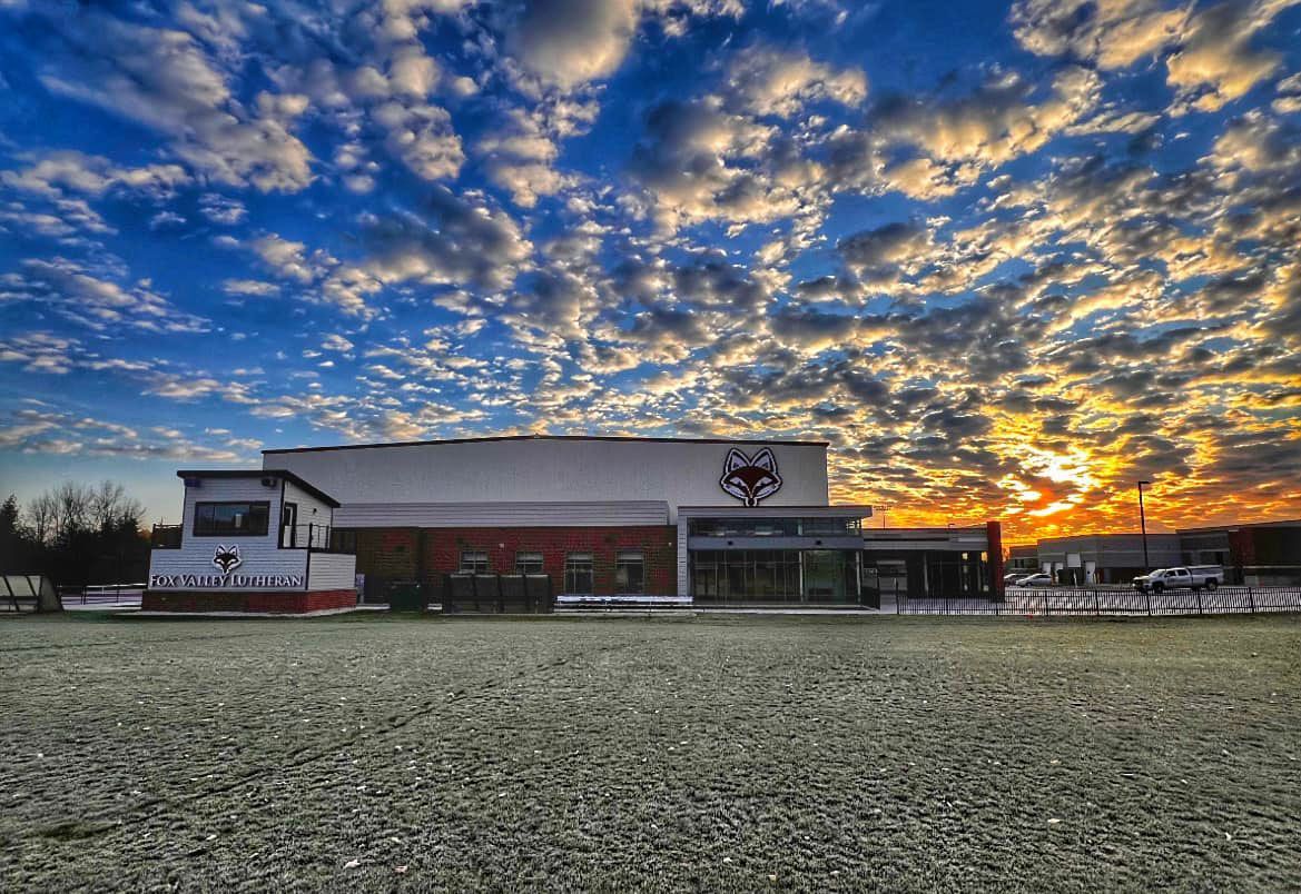 Timothy Trout Sports Center at sunrise with beautiful clouds and colorful sky