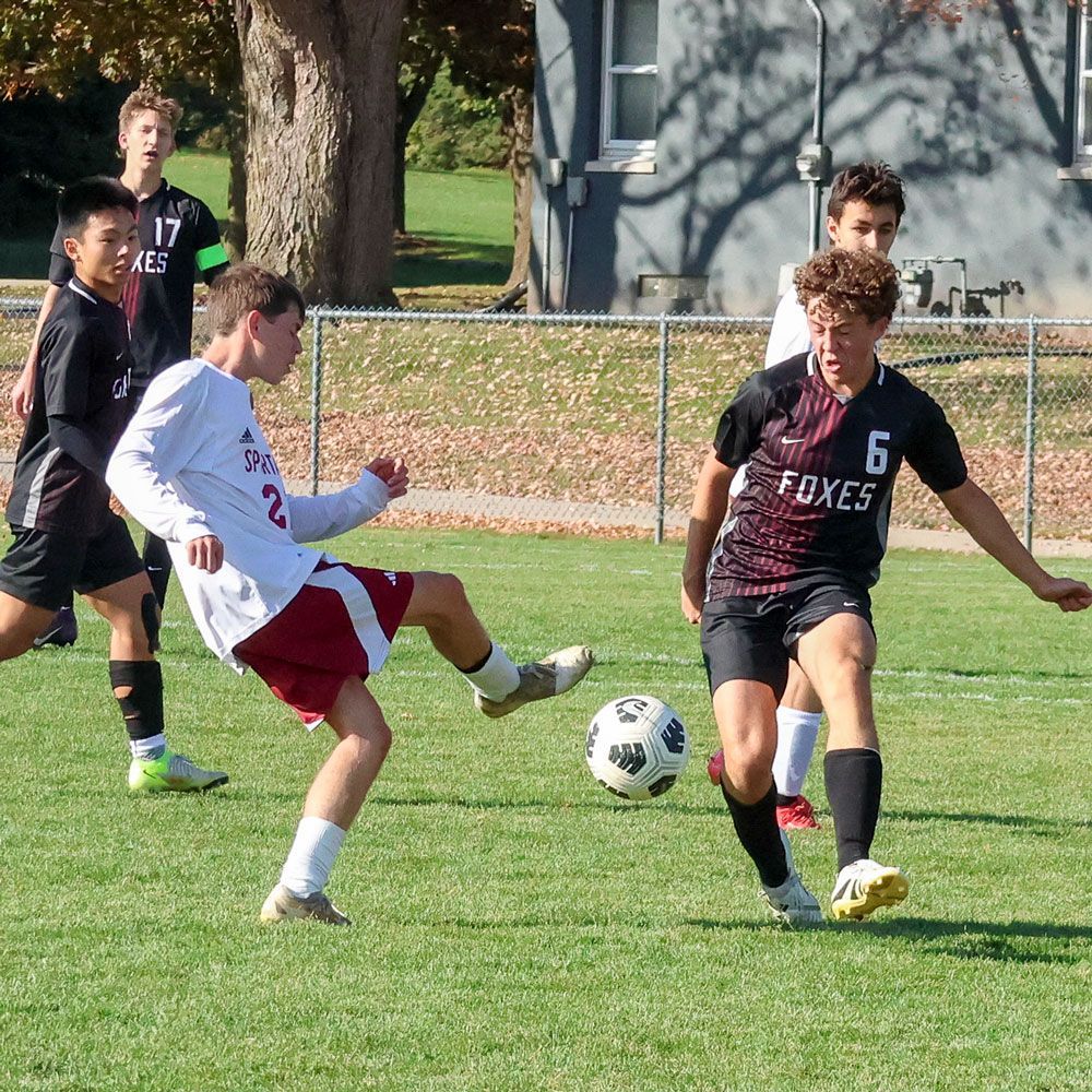Male soccer player with the ball during a match