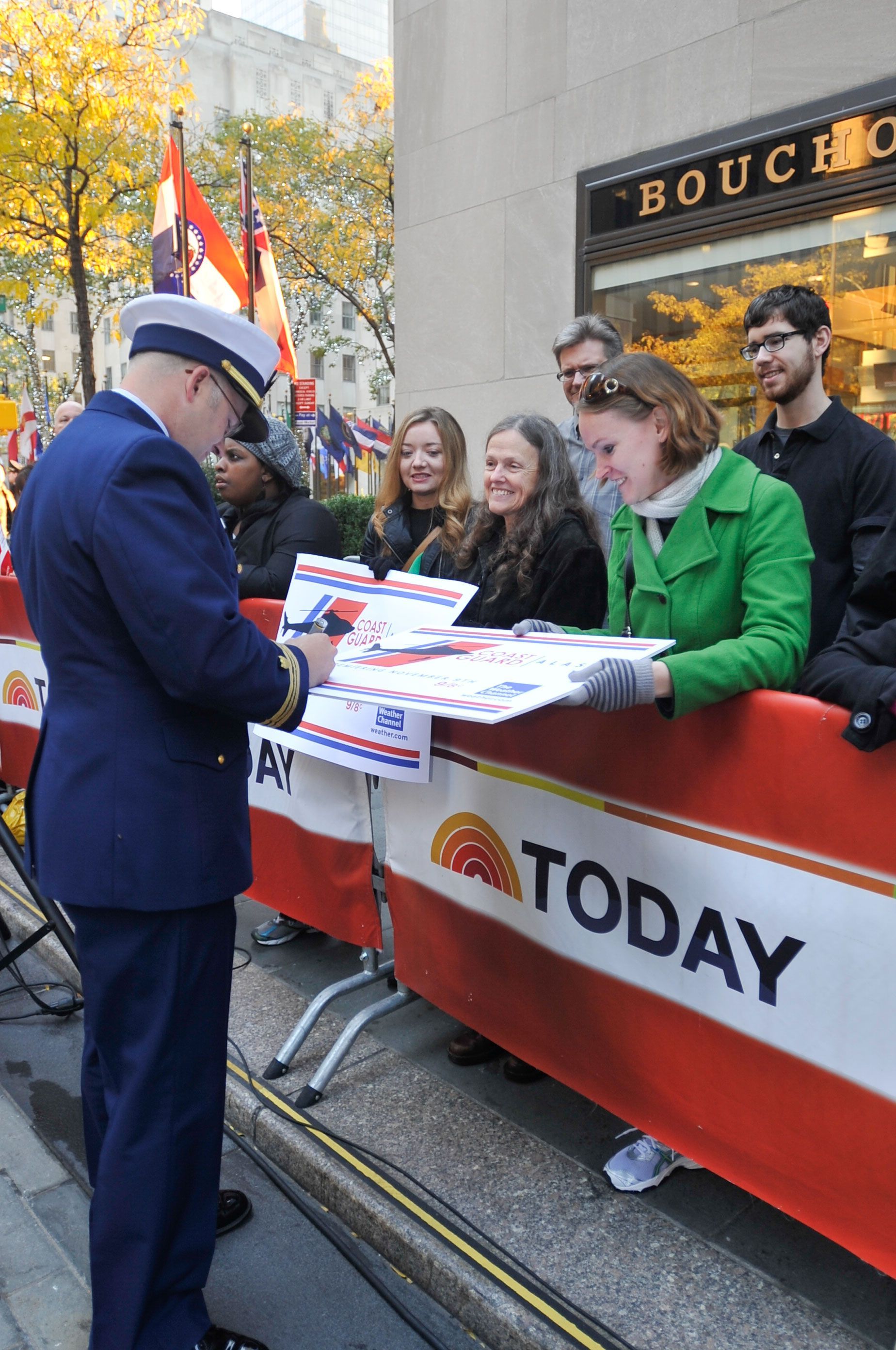 Signing autographs outside, in front of the Today Show barriers