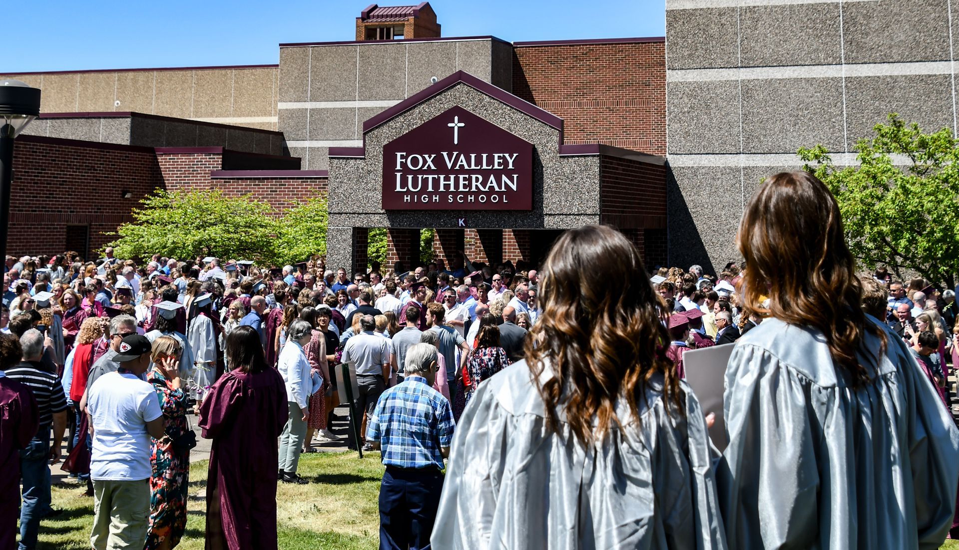 Commons entrance of FVL after graduation. Crowd of people outside.