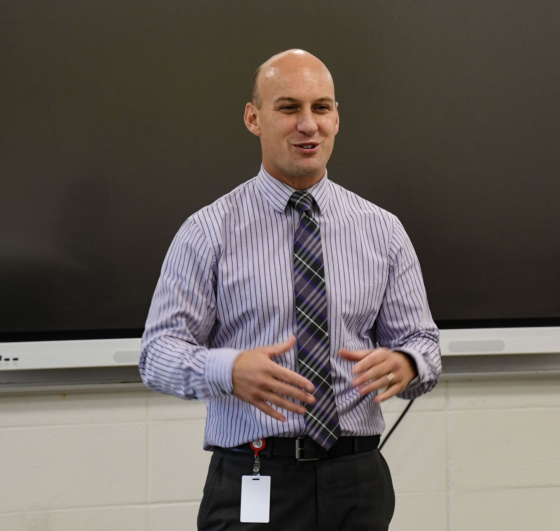 Rev. Steve Lehmann standing in front of the classroom, teaching