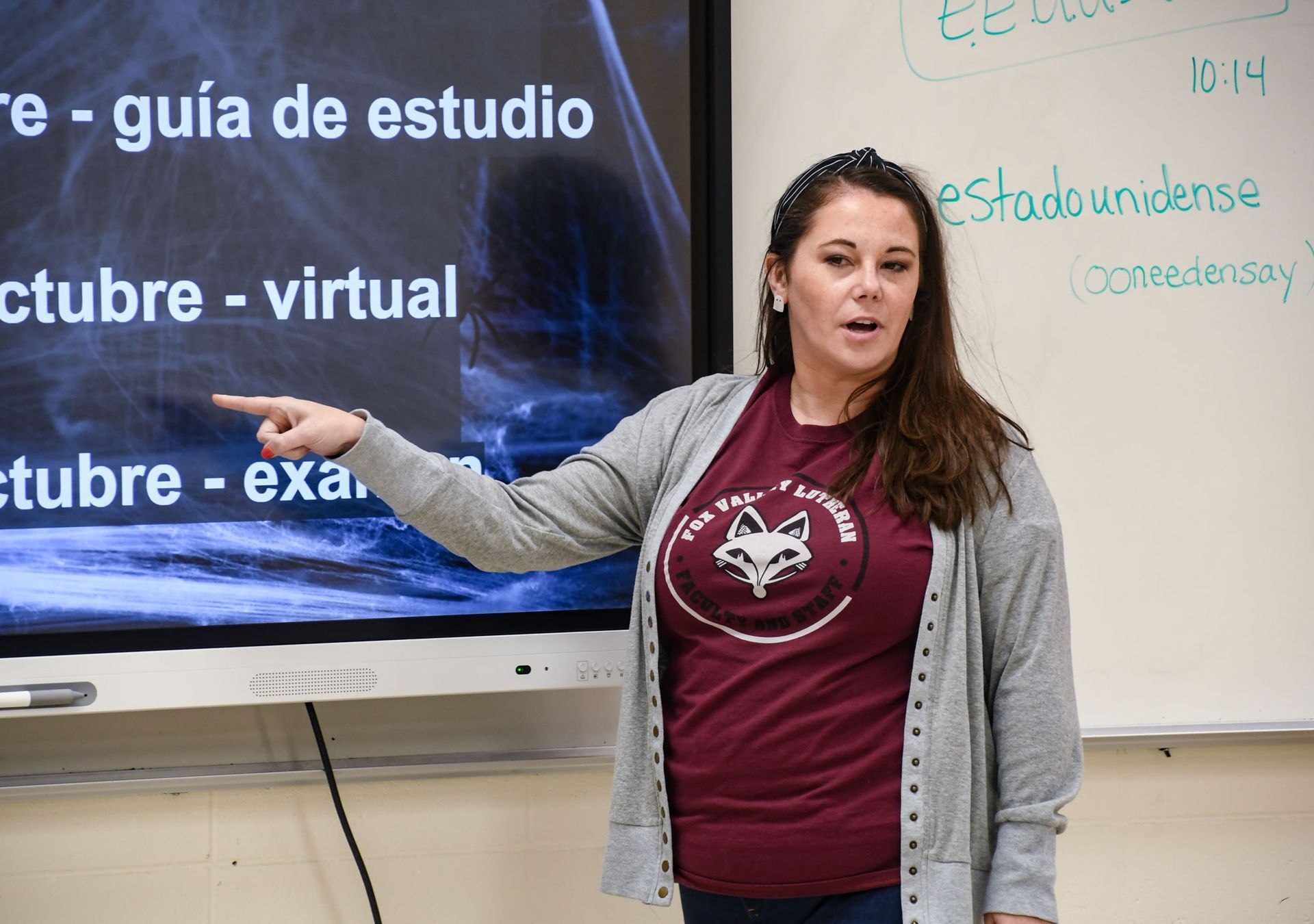 Jackie Gawel teaching Spanish - pointing to information on her smart board.