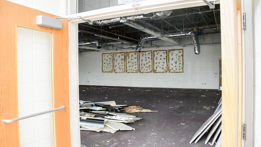 Looking in the doorway of the Study Hall with ceiling tiles and bulletin board removed