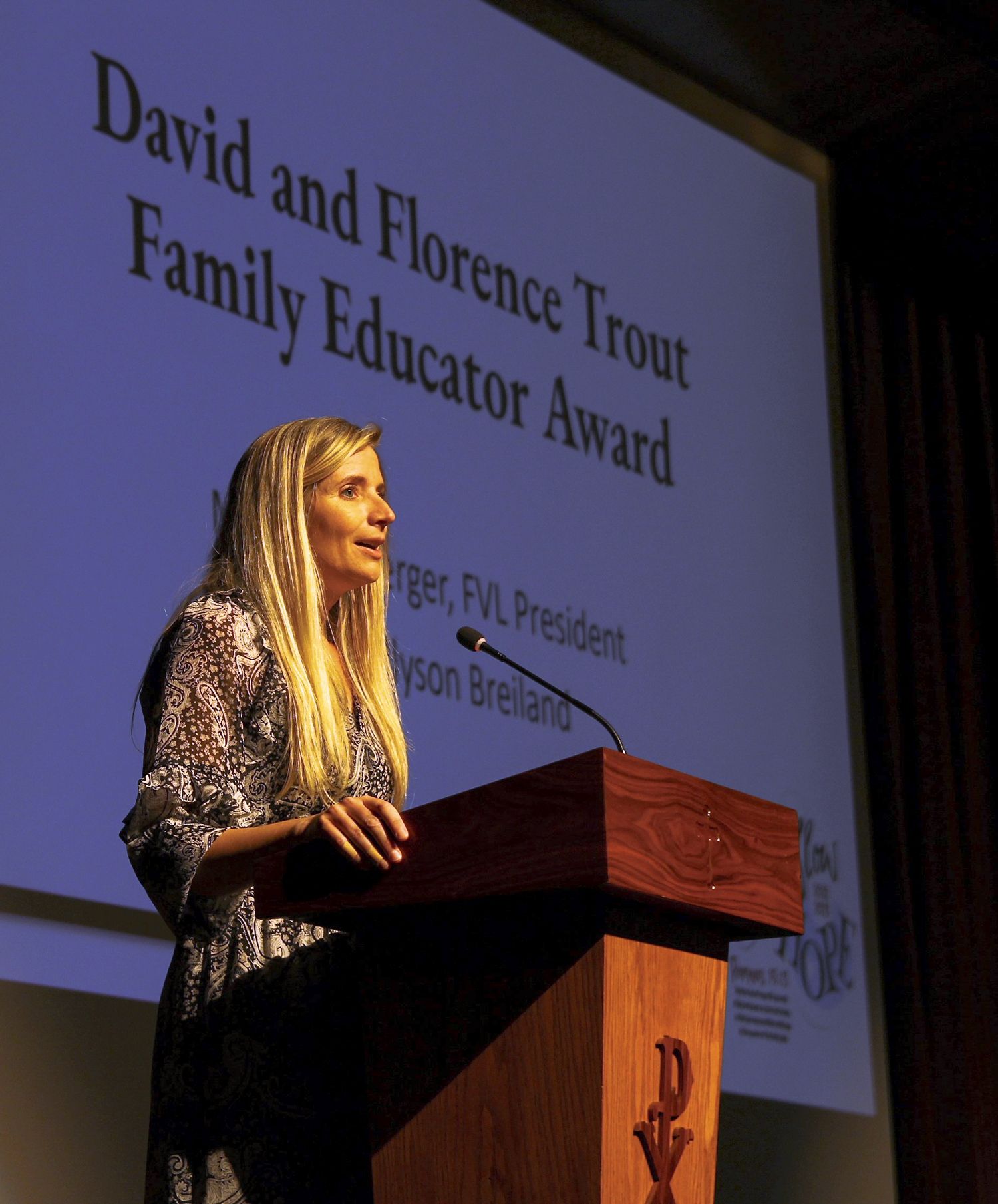 Amy Gilmet, on stage and saying thank you after having received the Trout Family Educator Award