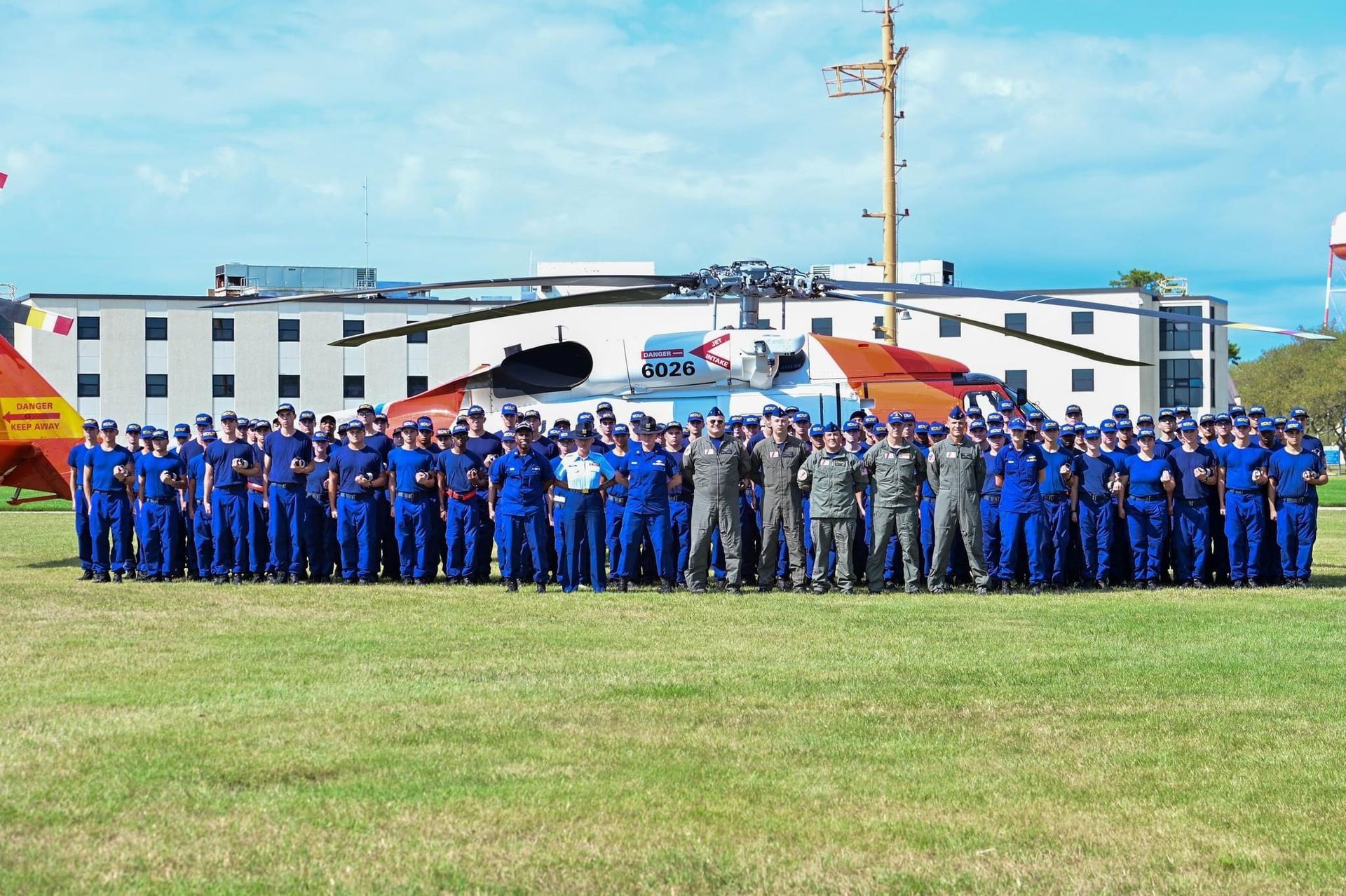 Company of Coast Guard members in front of Sexton Hall.