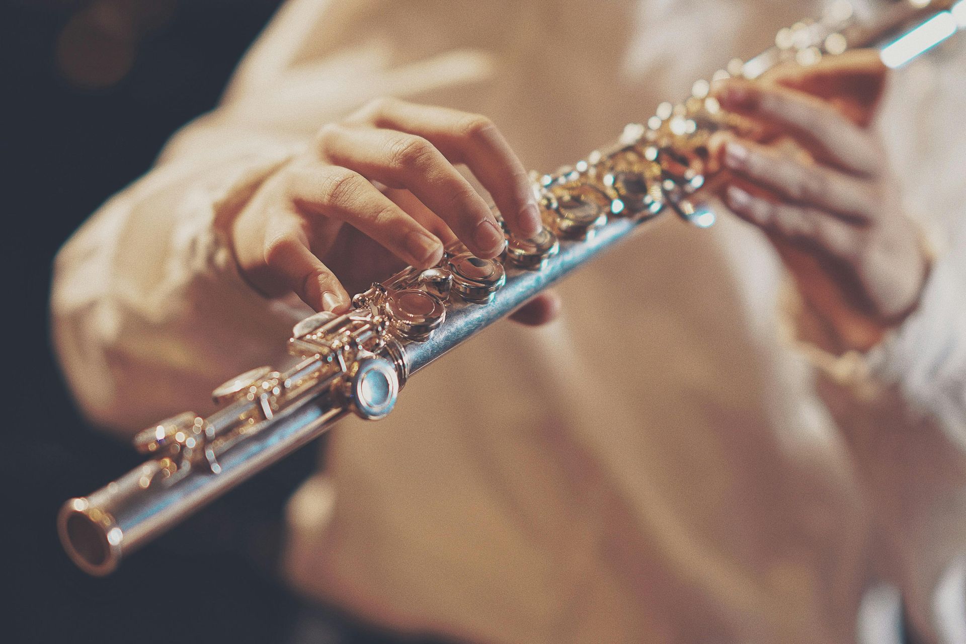 Hands on a flute - someone is playing, but cannot see the person