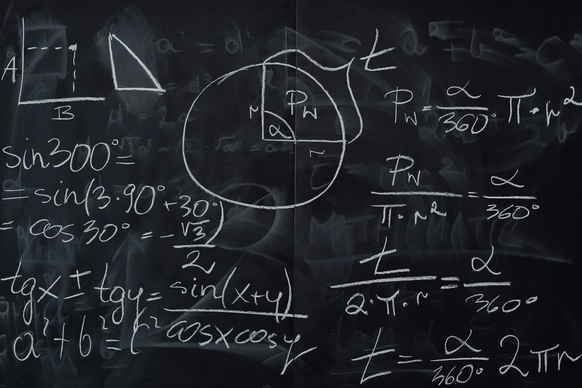 Blackboard with math equations written on it