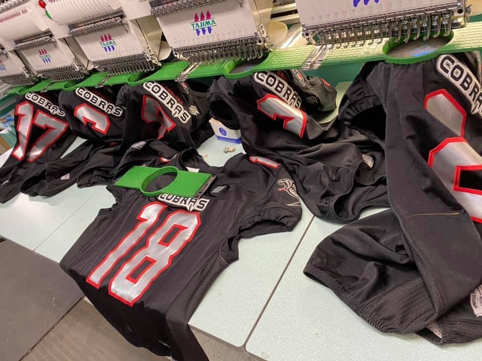 Football jerseys with embroidered numbers and 
