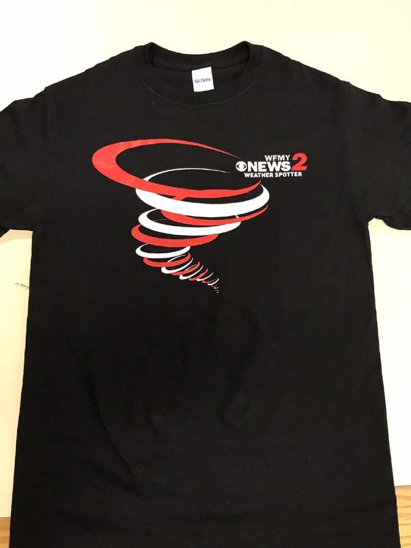Black t-shirt with a red and white tornado graphic and 