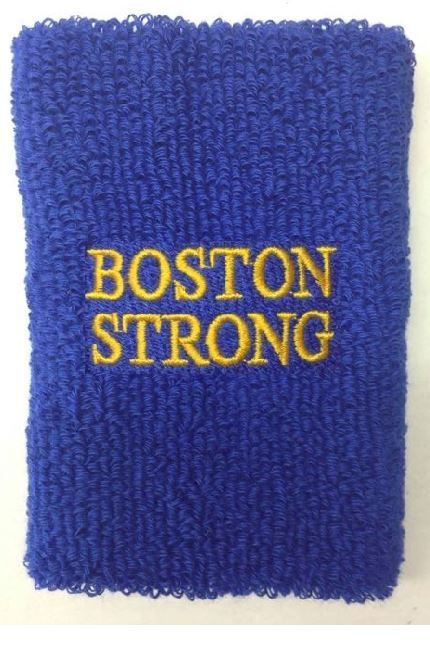 Blue wristband embroidered with gold text 