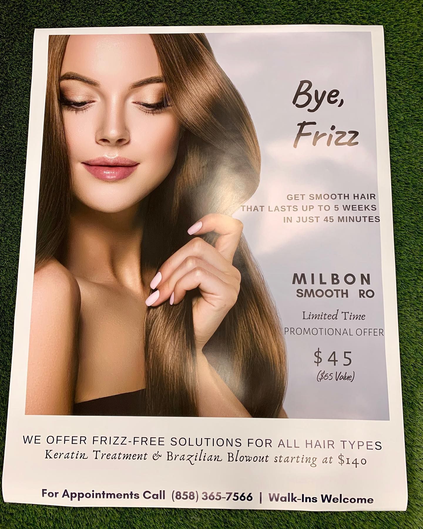 Salon poster for frizz treatment, showing a woman with smooth brown hair and promotional text about a $45 service.