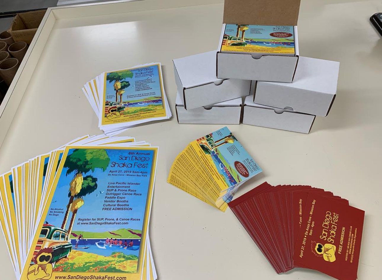 Assorted colorful printed cards and folded boxes arranged on a tabletop display